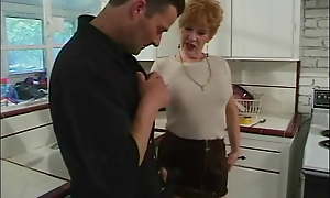 Younger impoverish gets blown by 70 year old redhead in kitchen