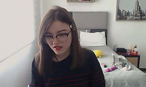 Latin nerd girl with glasses in her first days as A a webcam girl