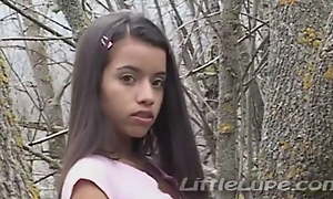 Little Lupe masturbates her tight pussy all round the woods
