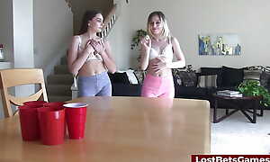A lesbian couple loses a strip-pong game and fucks the camera guy