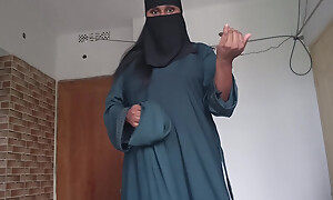 Diffident muslim girl drawing retire from burqa slowly