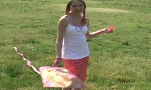 Innocent teen Kitty flying her kite