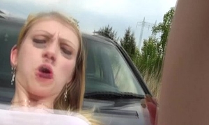 Hitch hiking fair-haired teen fucked in excess of car